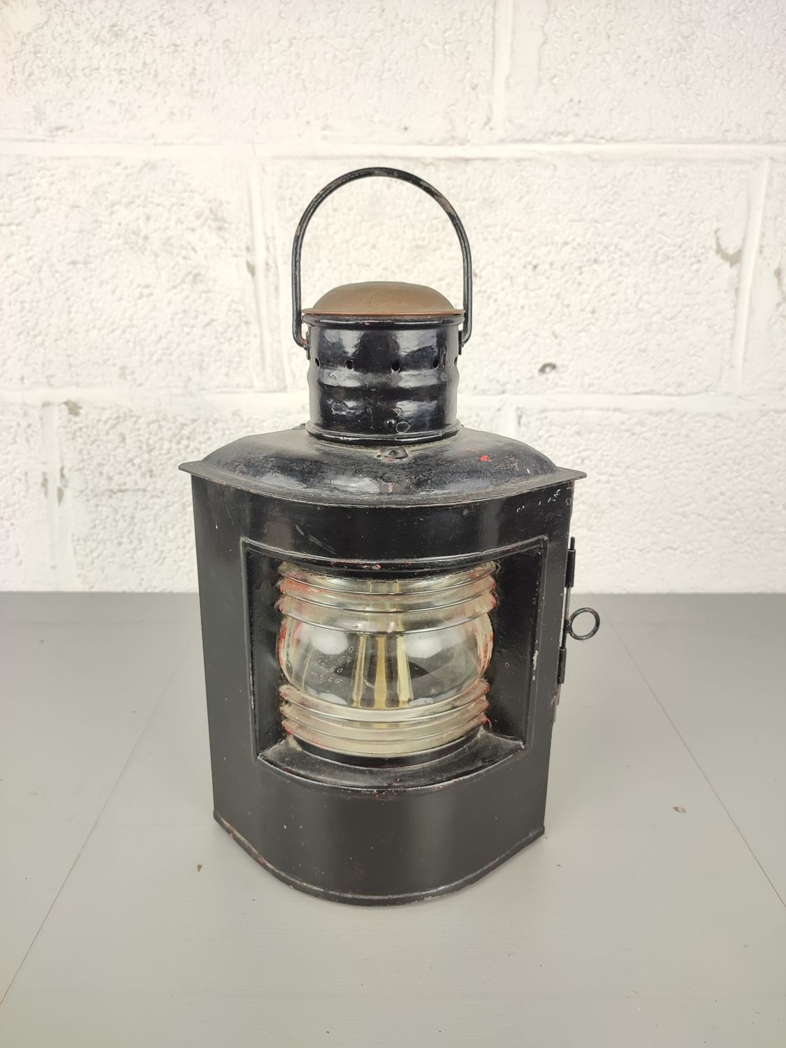 Old black-painted ship&#39;s lamp
