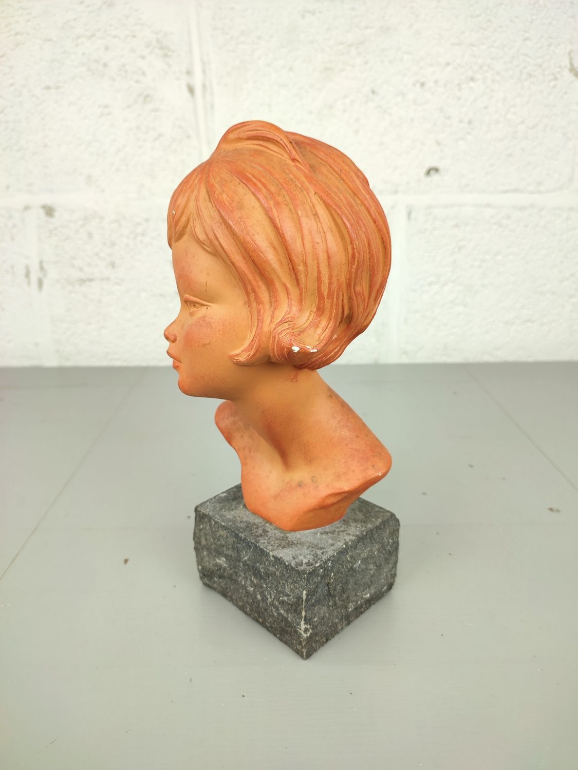 Bust of a girl in plaster, by Melani