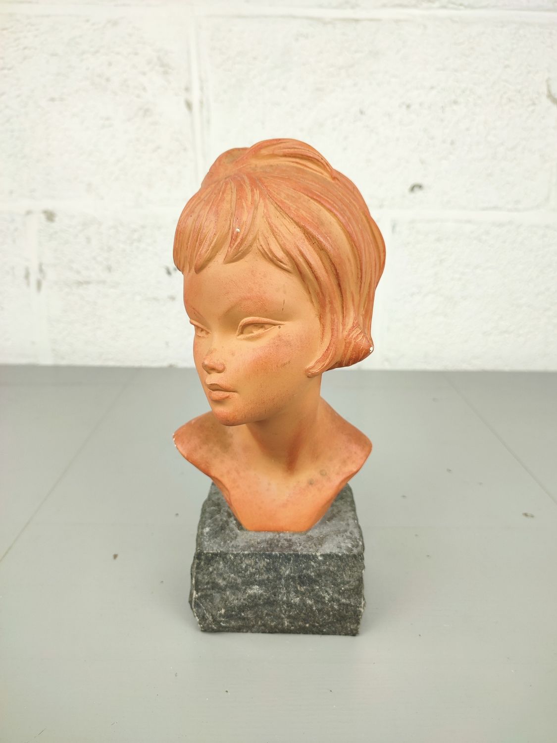 Bust of a girl in plaster, by Melani