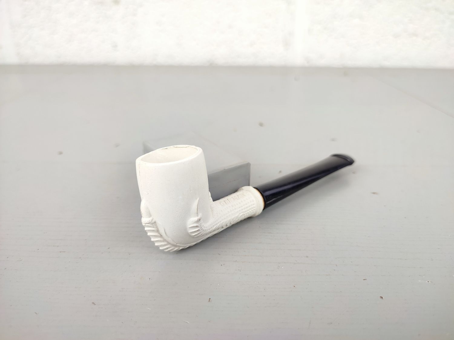 Old clay pipe with claw