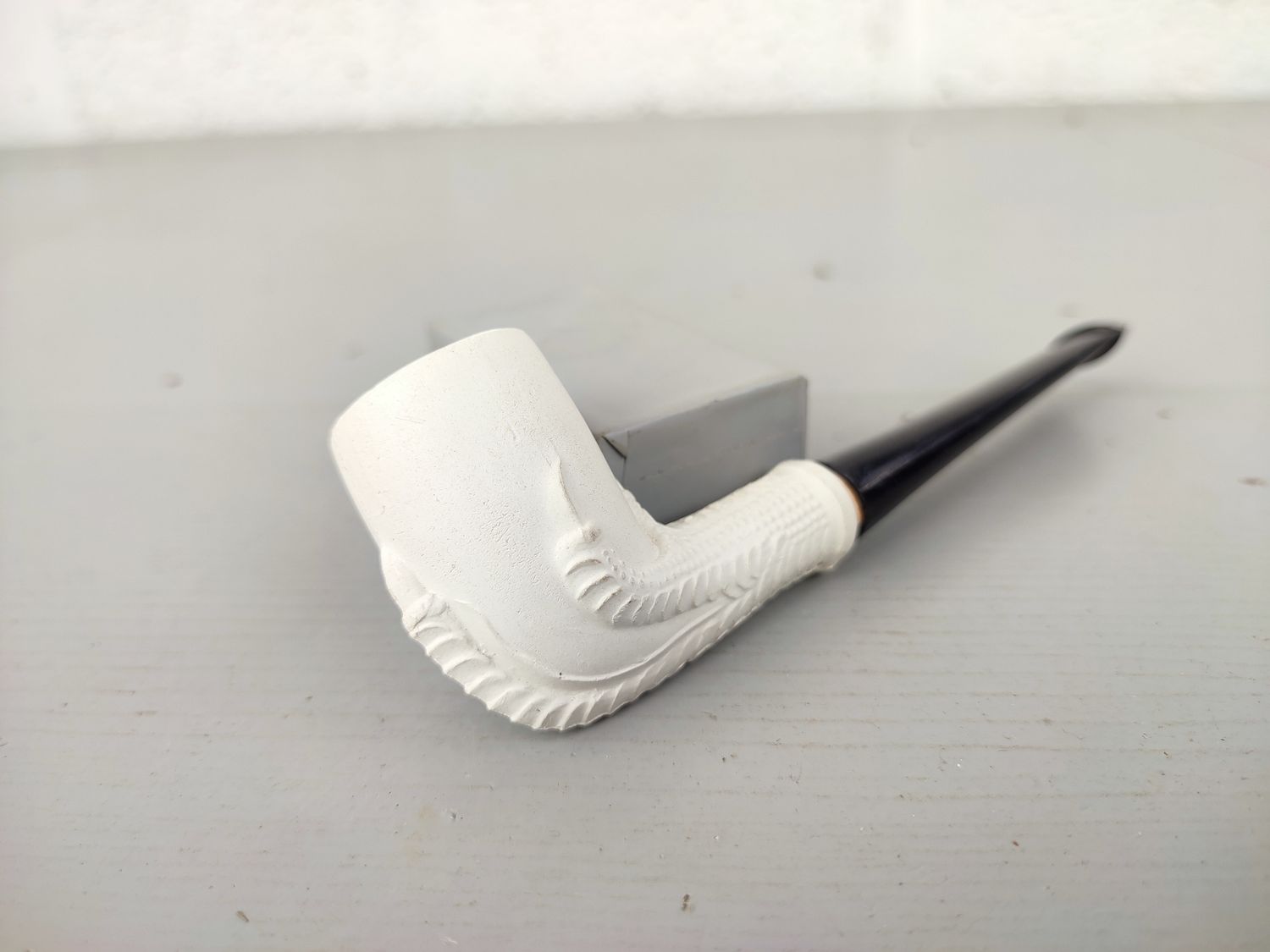 Old clay pipe with claw