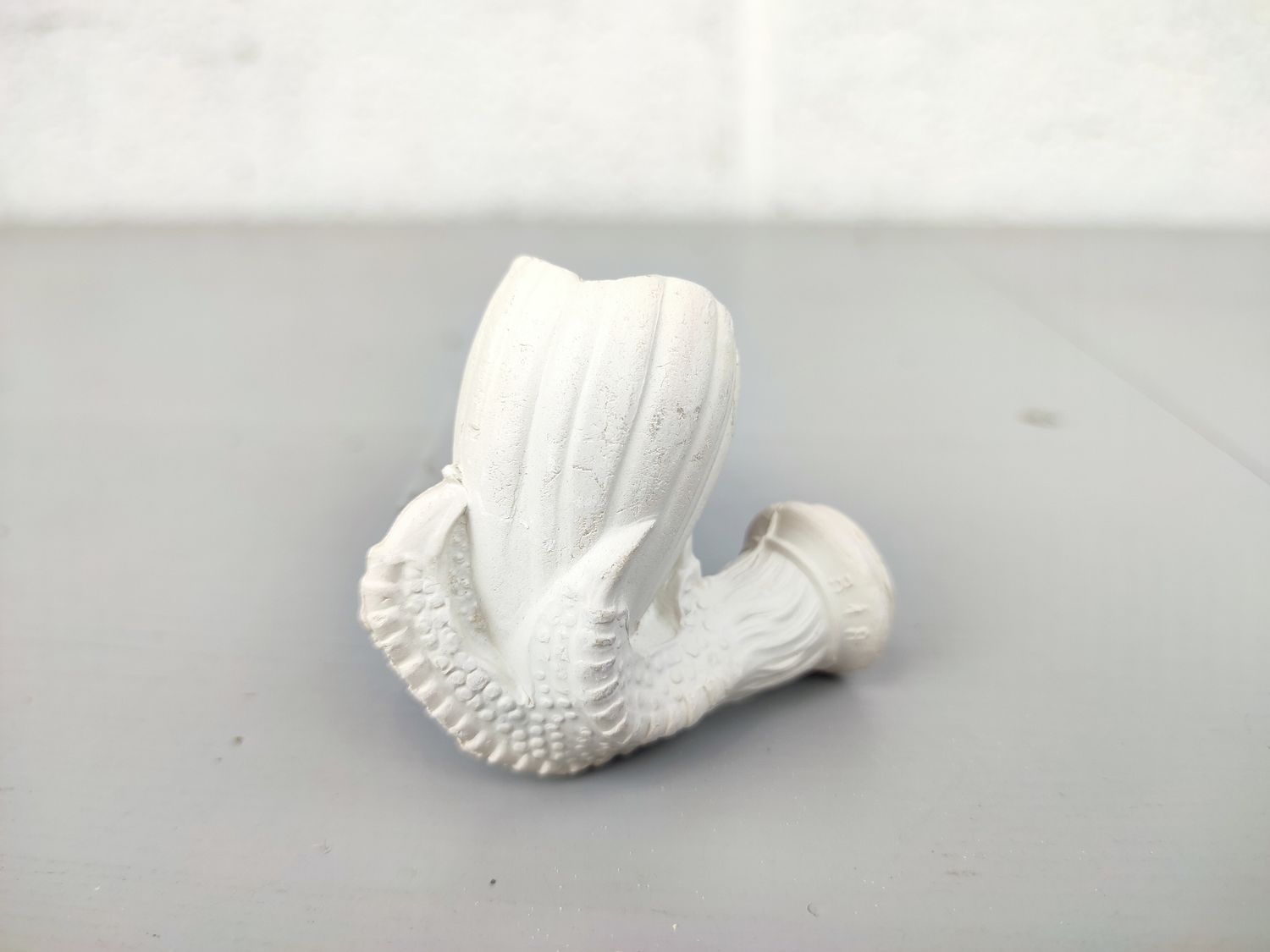 Old clay pipe head with claw
