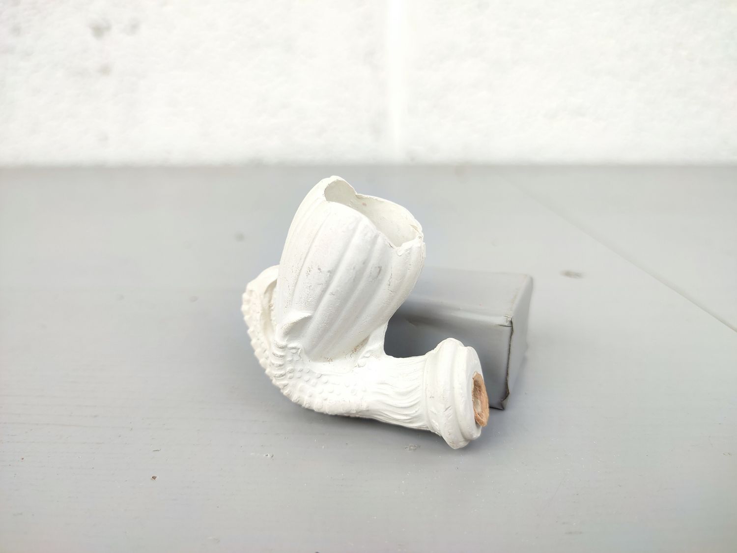 Old clay pipe head with claw