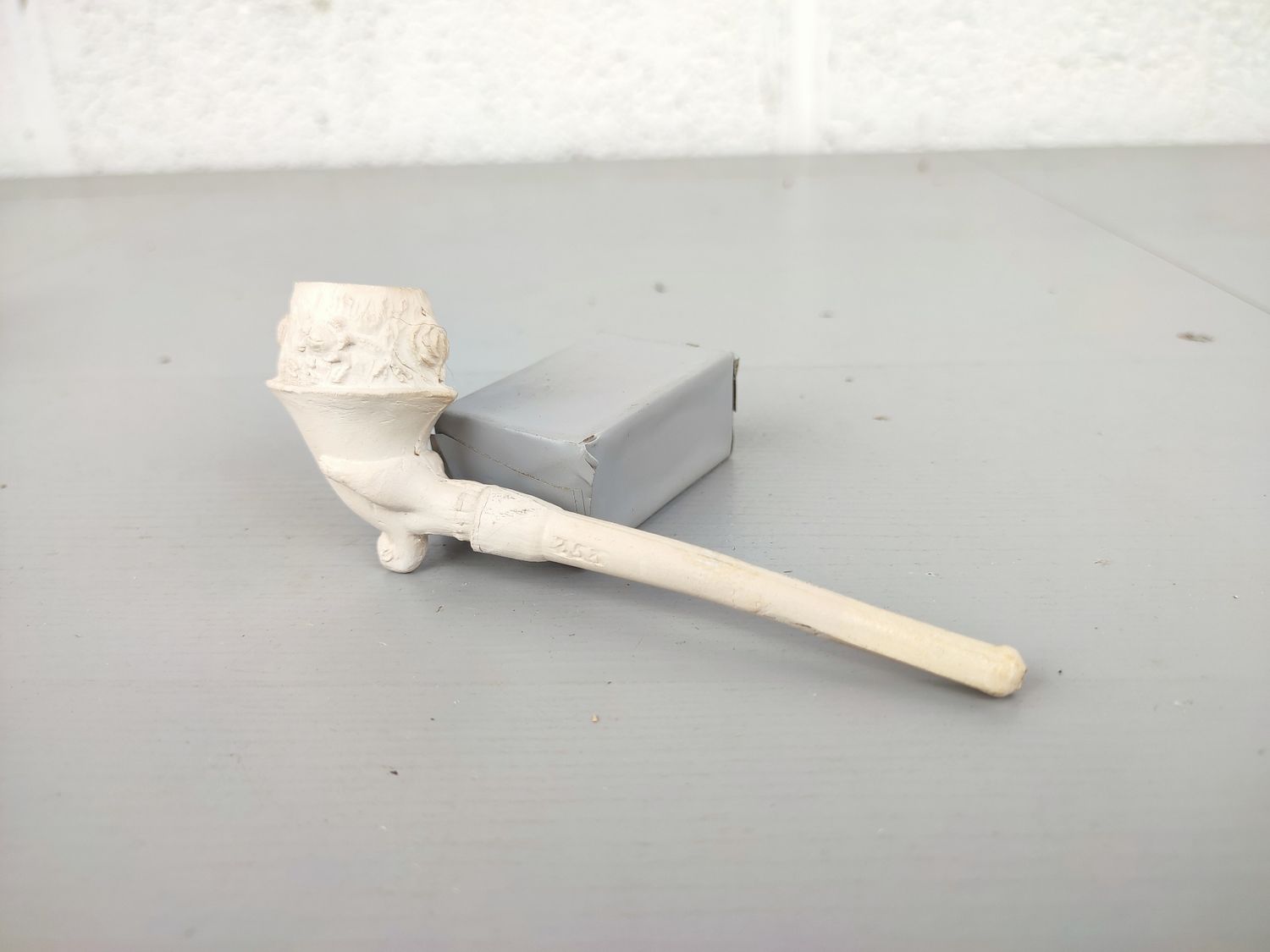 Old clay pipe with cornucopia