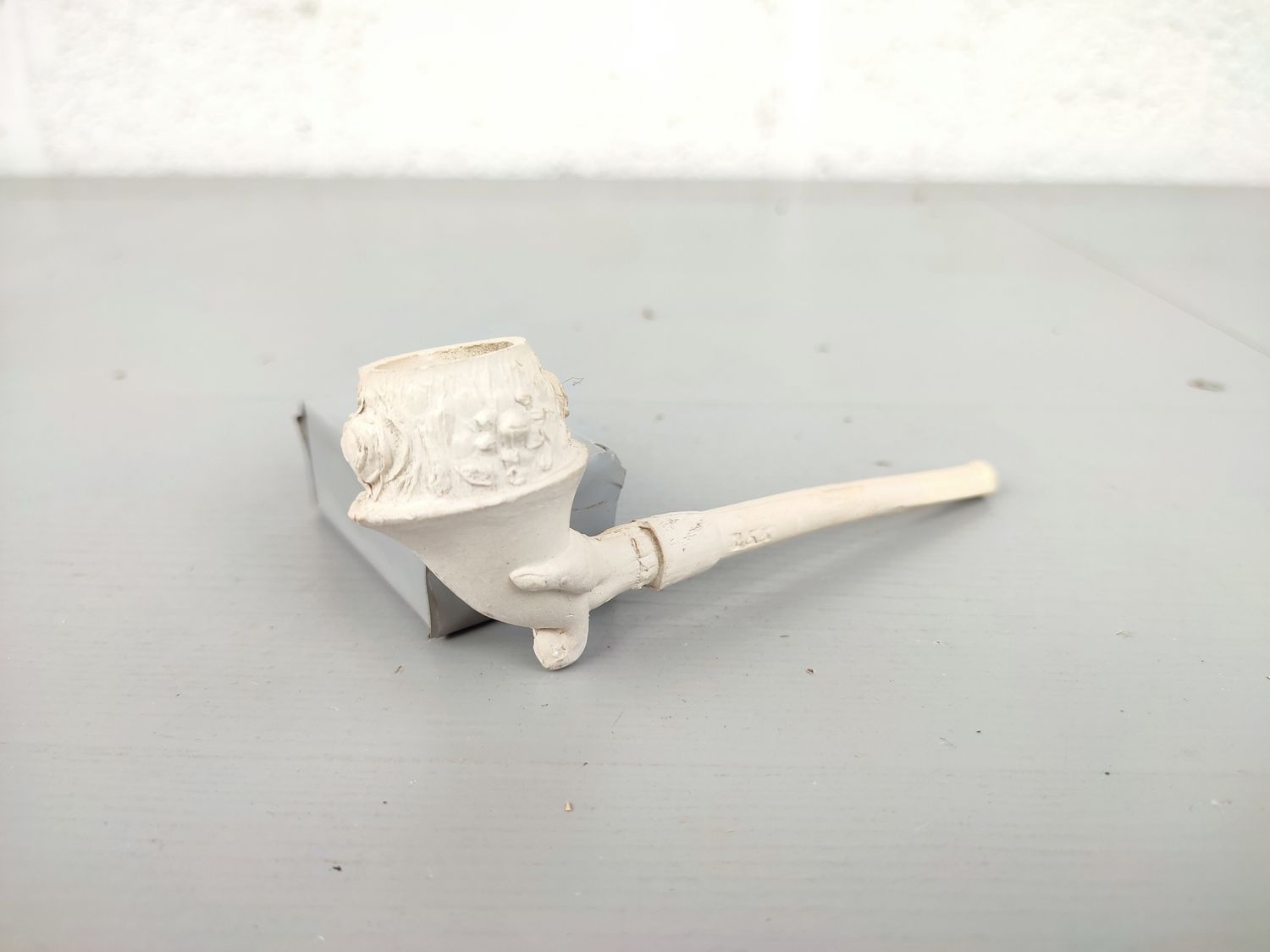 Old clay pipe with cornucopia