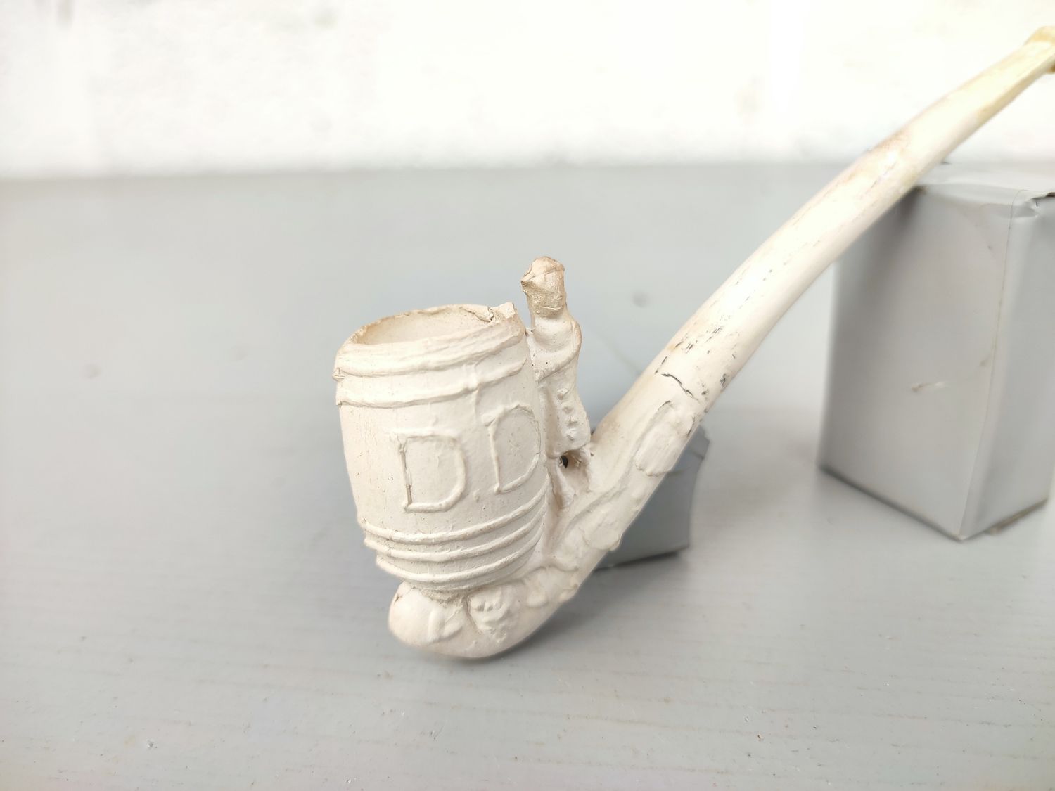 Old clay pipe with wine barrel venter
