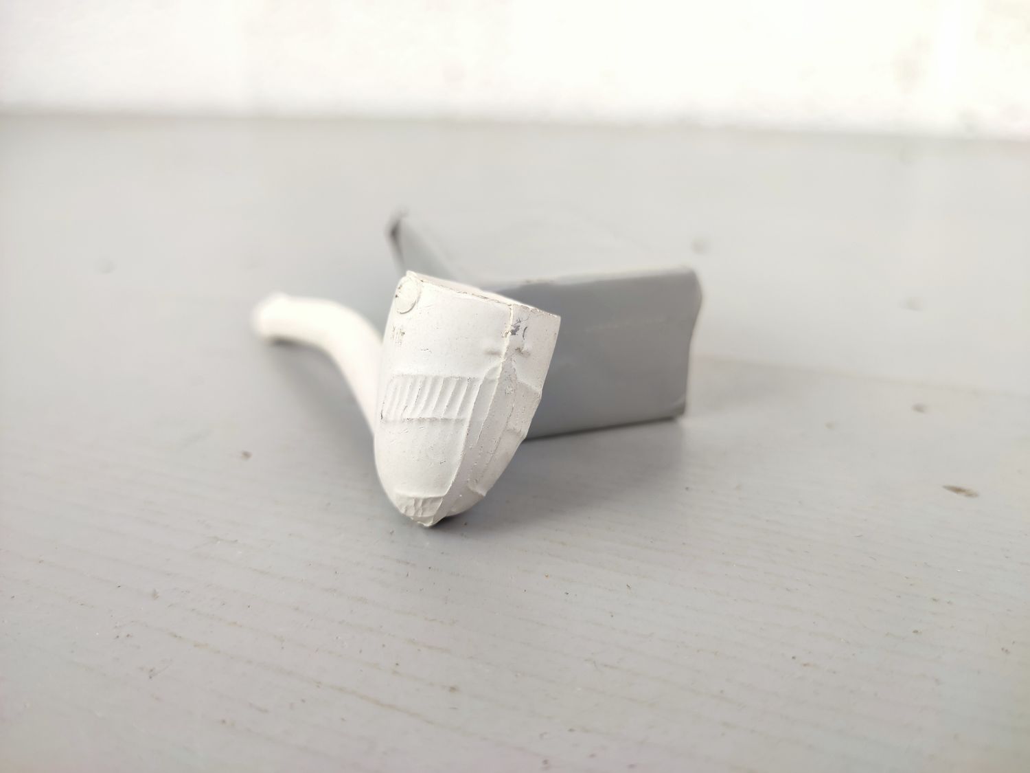 Old clay pipe with airplane