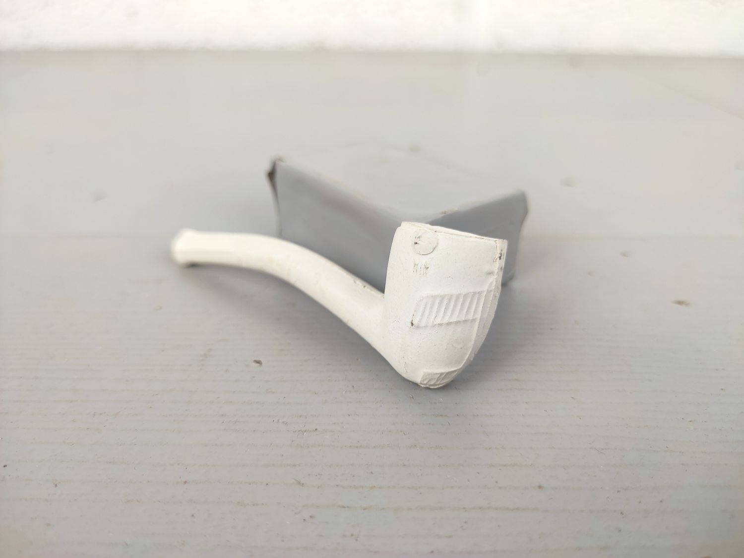 Old clay pipe with airplane
