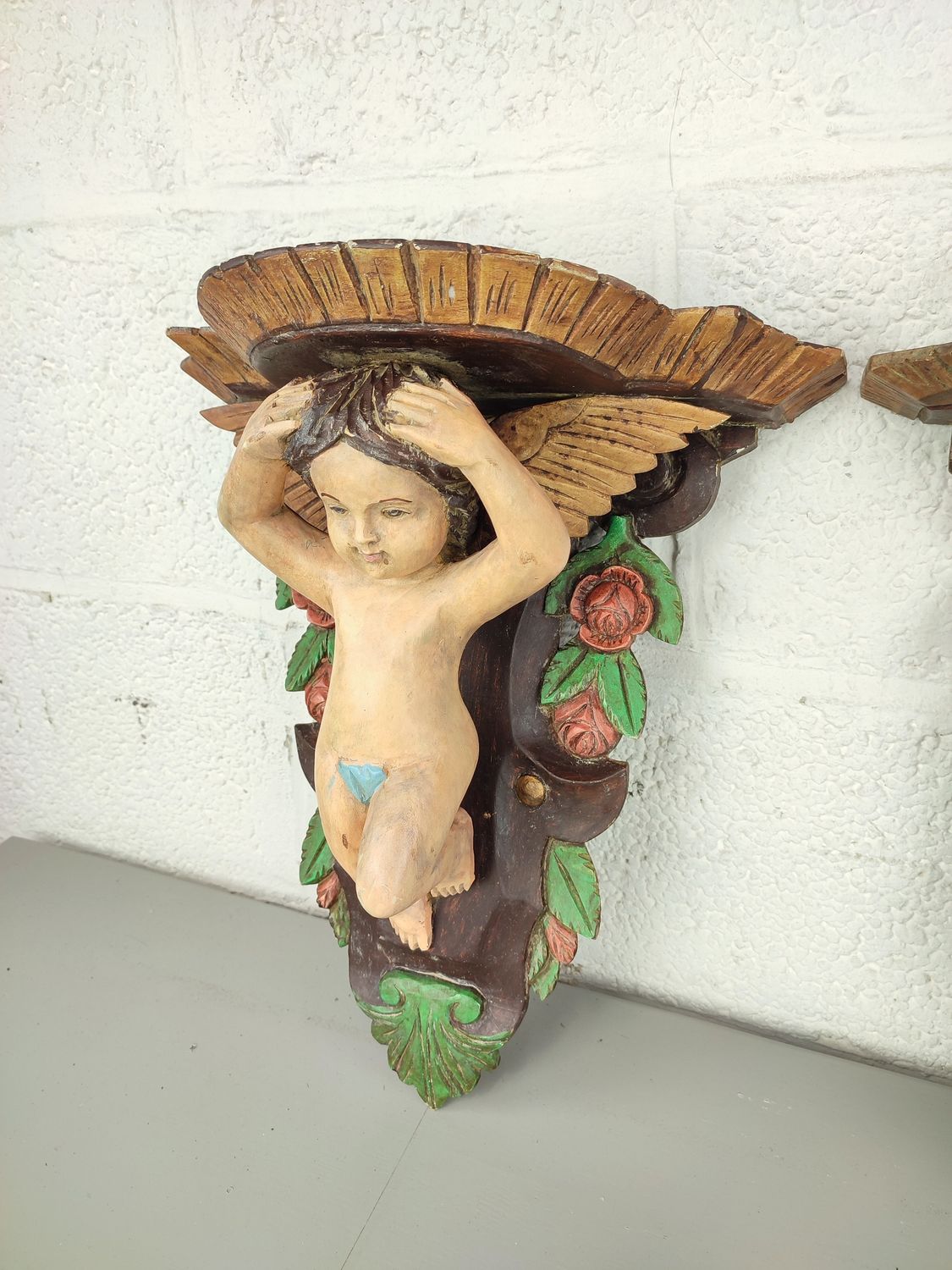 2 wooden wall ornaments with cherubs