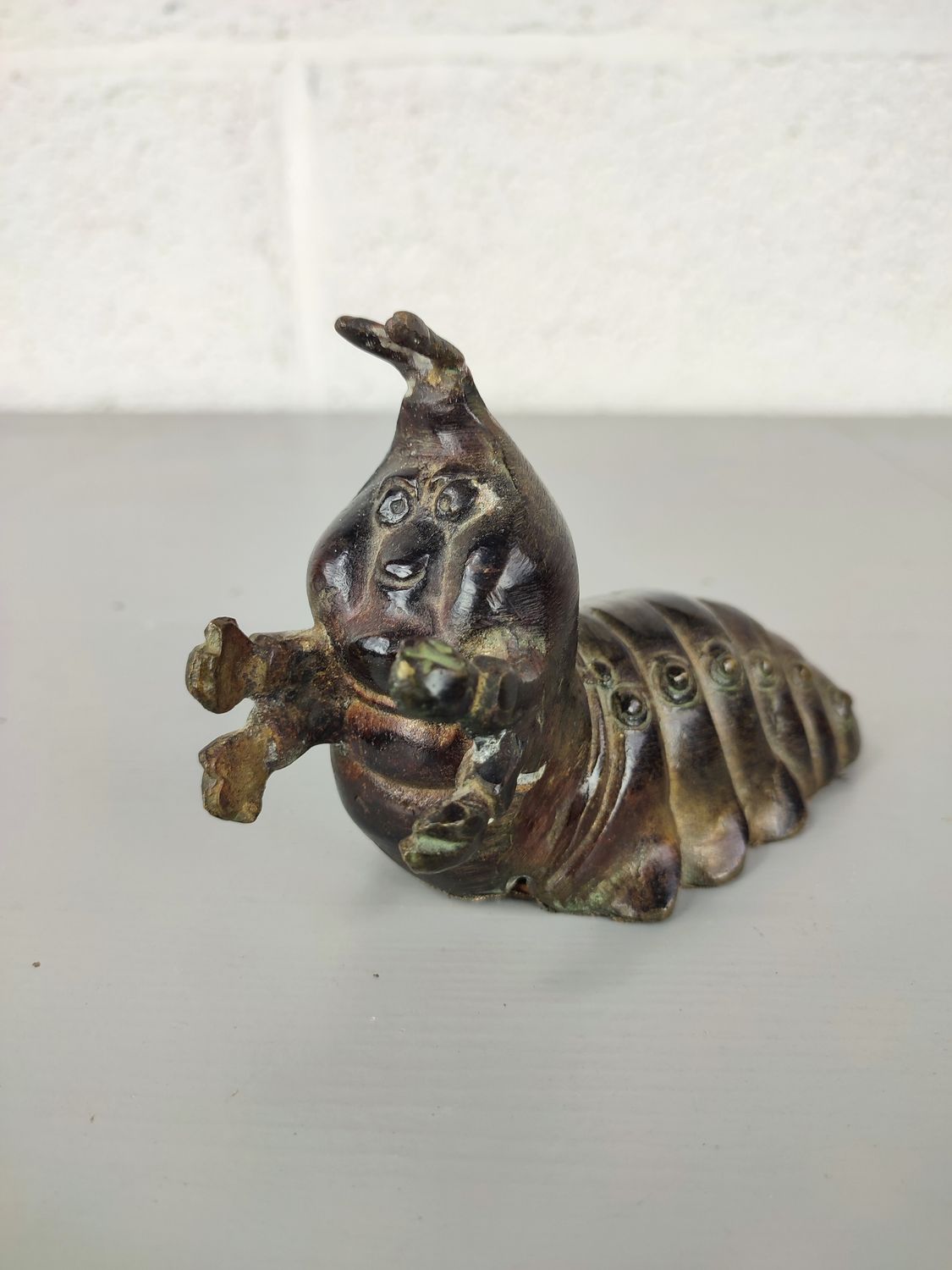 Bronze caterpillar figurine