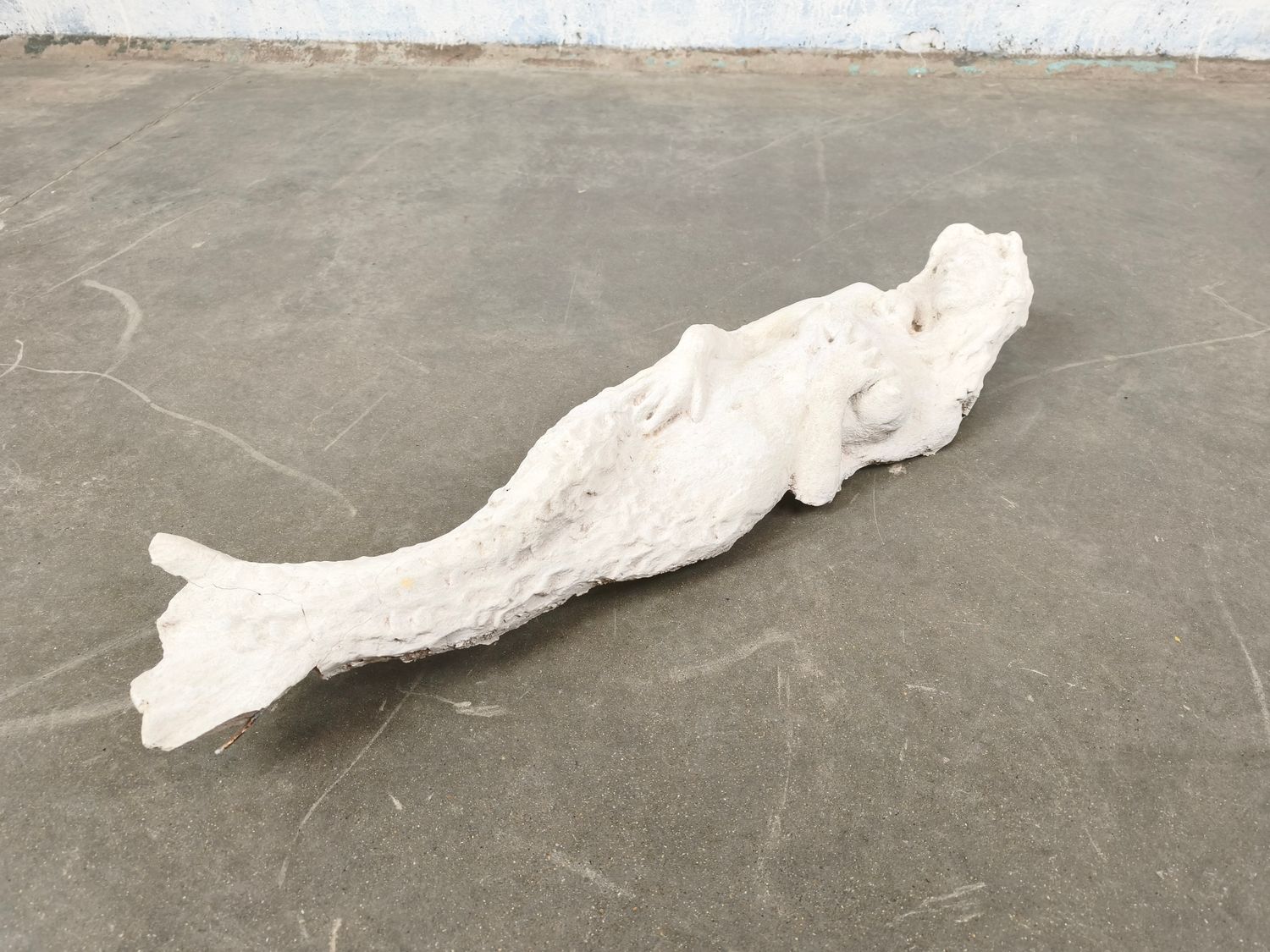 Large concrete mermaid by Gilbert Van Belleghem