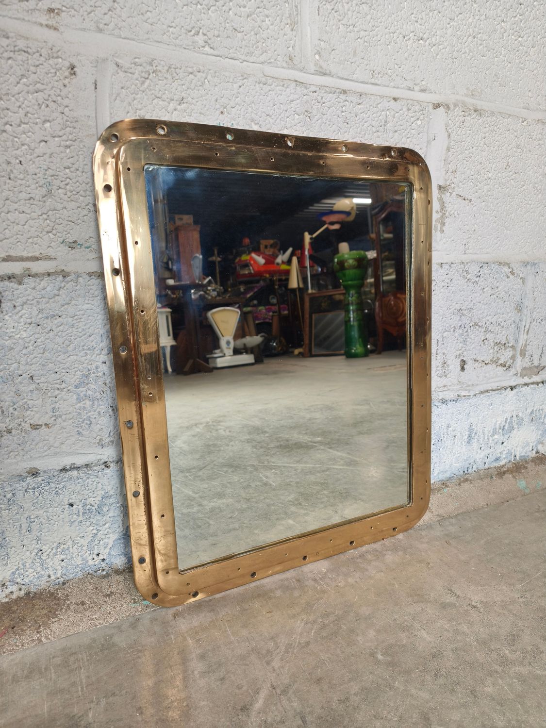 Antique ship&#39;s porthole with mirror