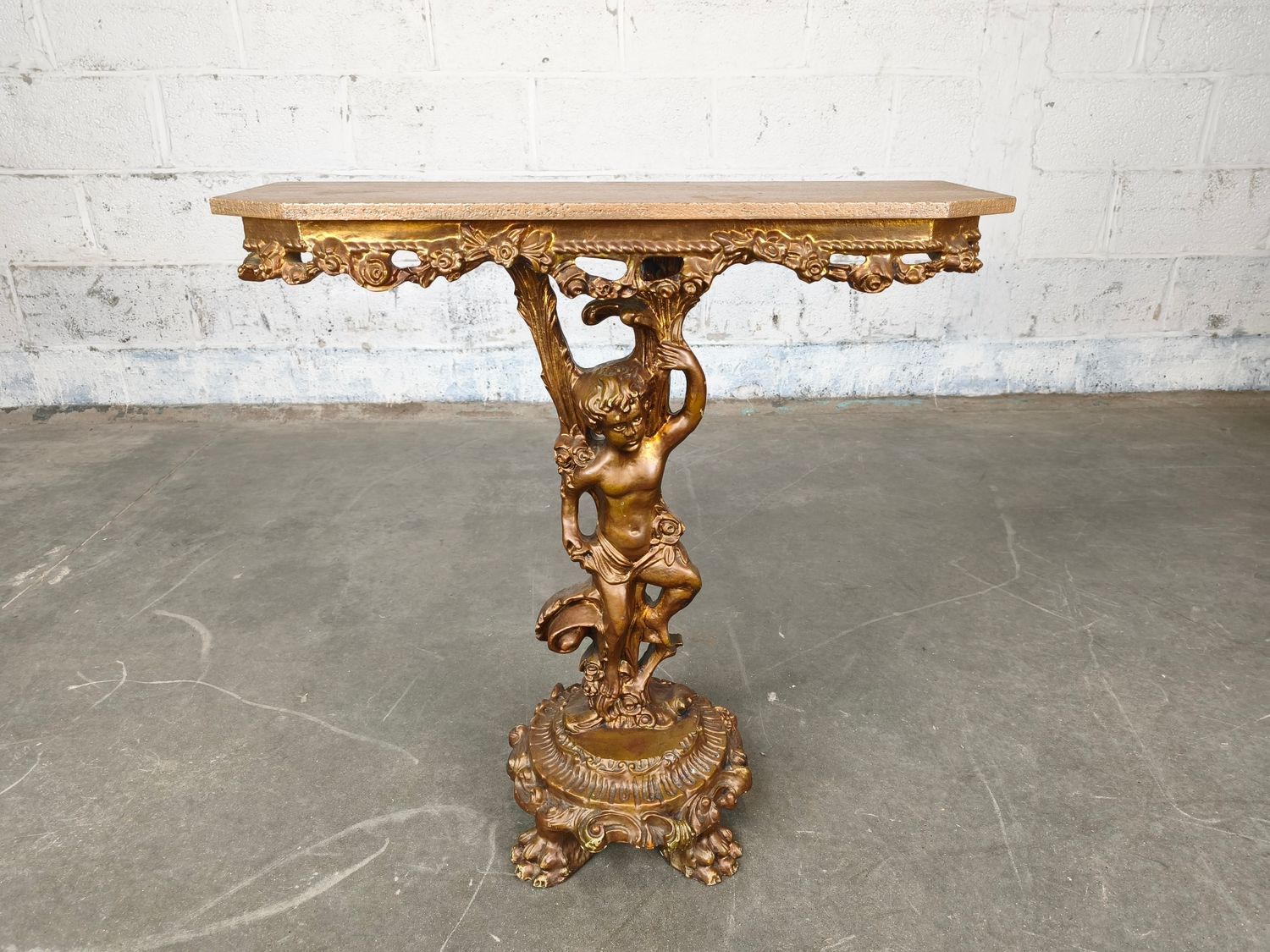 Gilded console table with cherub