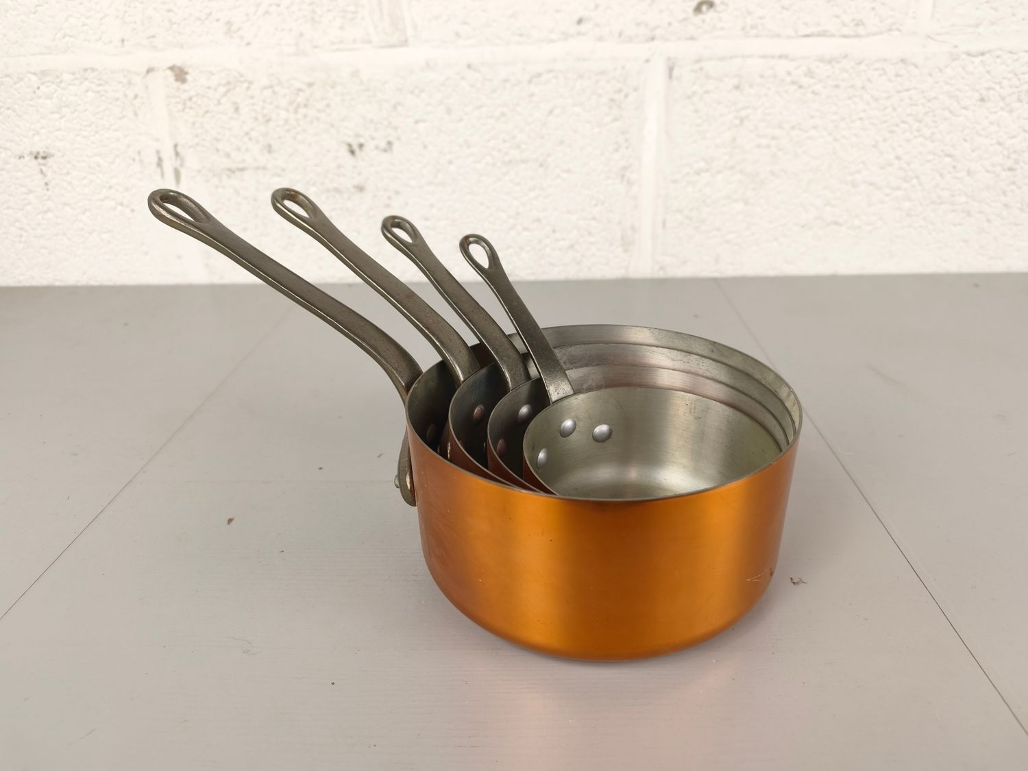 4 copper pans 'les cuivres de Faugogney'