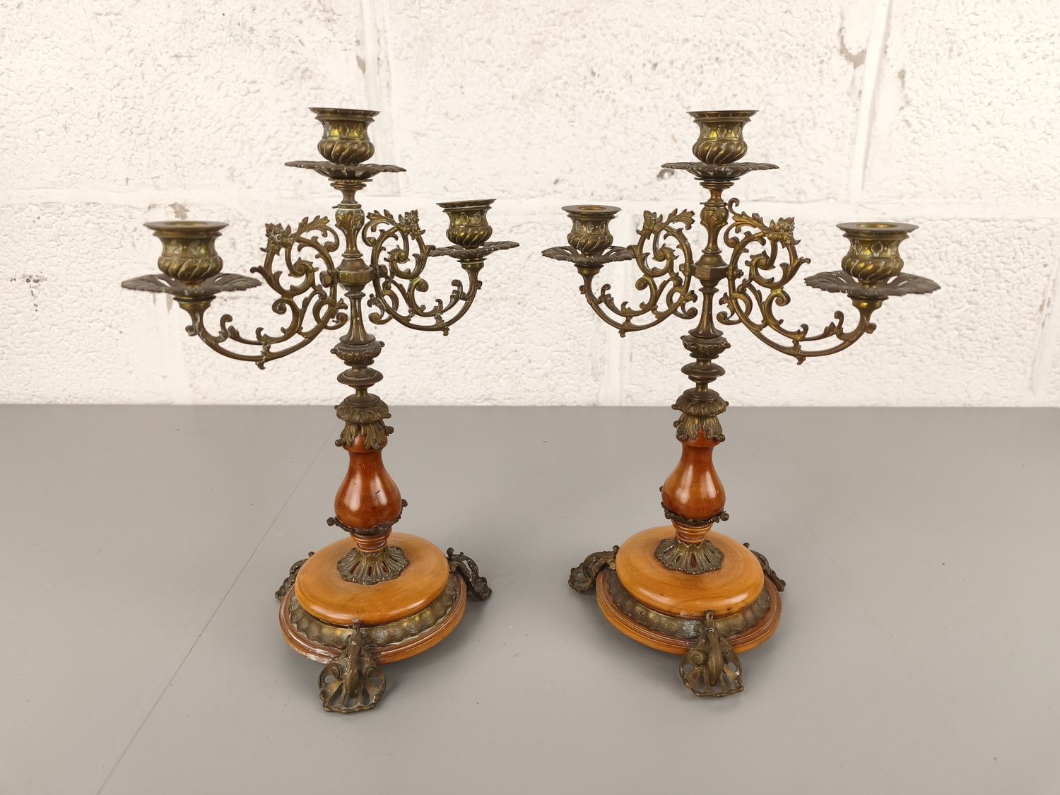Pair of wood &amp; brass candelabras