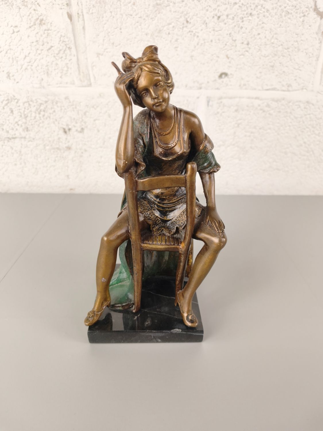 Bronze statue of a seated lady