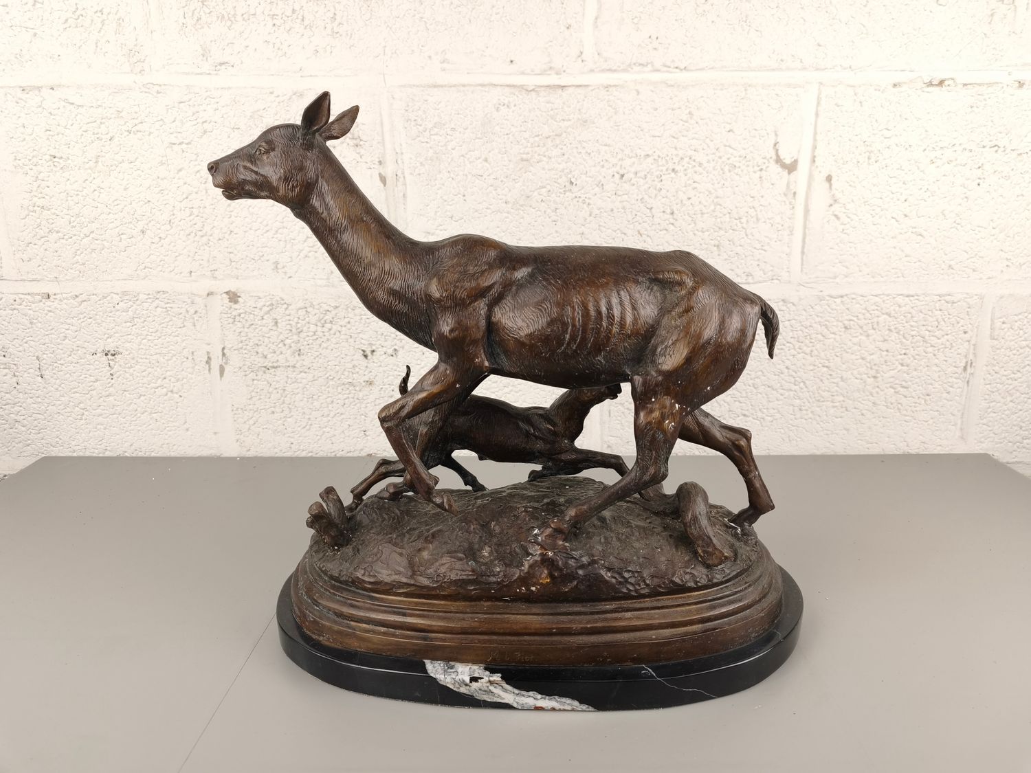 Bronze statue of deer