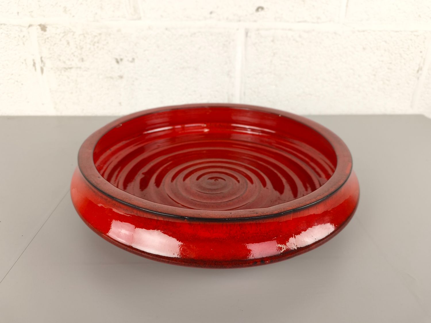 Large red ceramic bowl