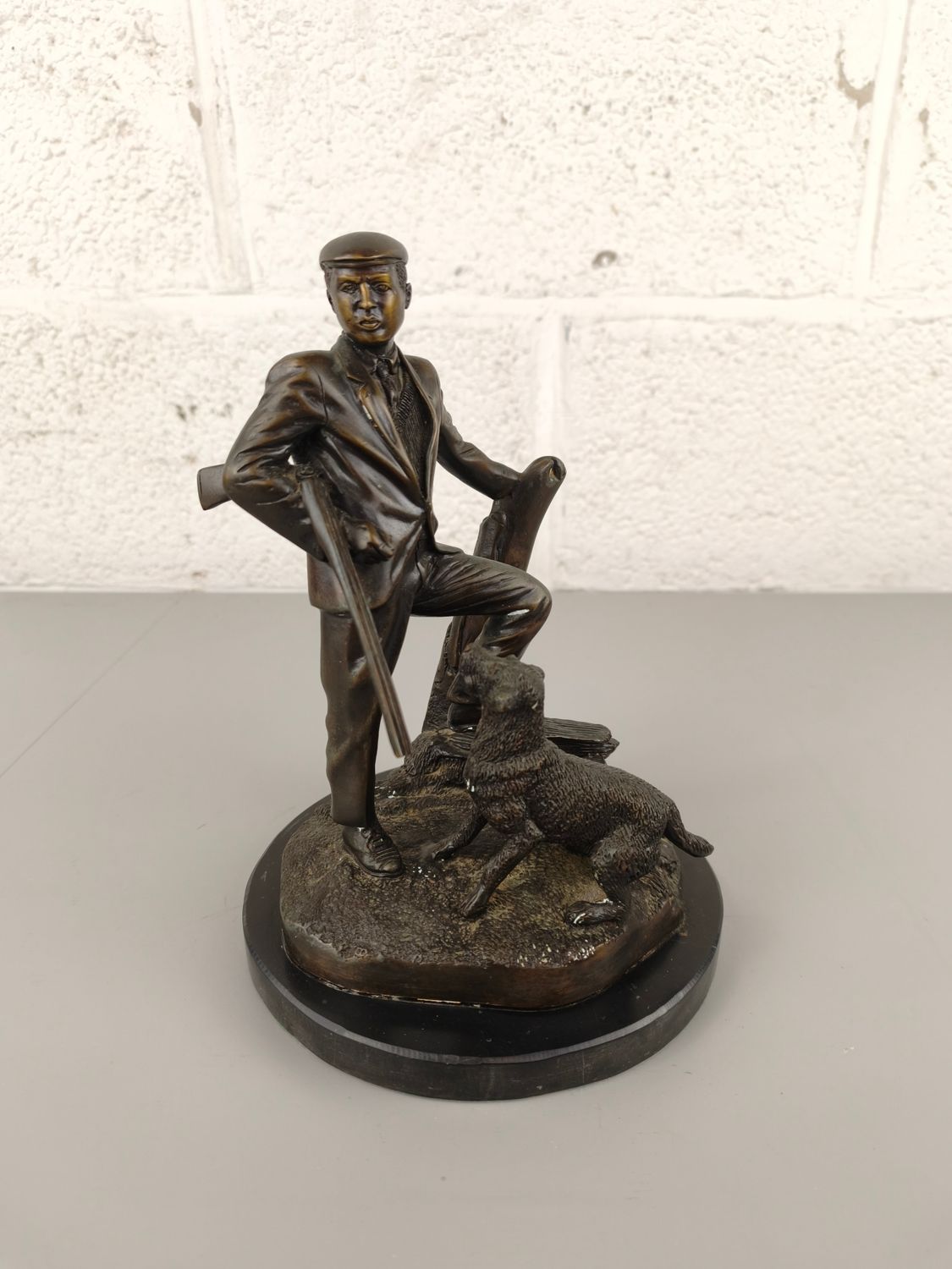 Bronze statue of a hunter with dog