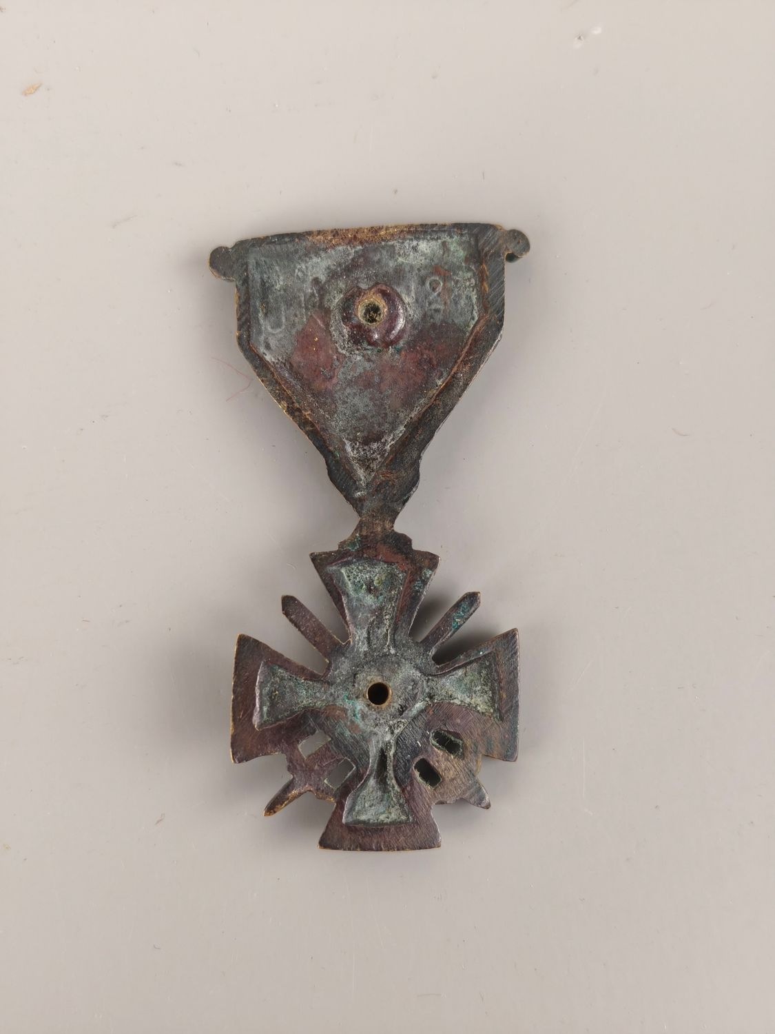 Bronze medal from on a memorial plaque.