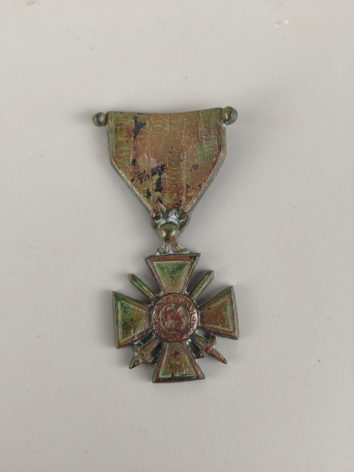 Bronze medal from on a memorial plaque.