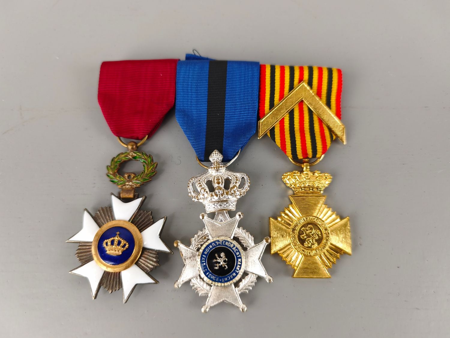3 Belgian medals on bar with ribbon bar