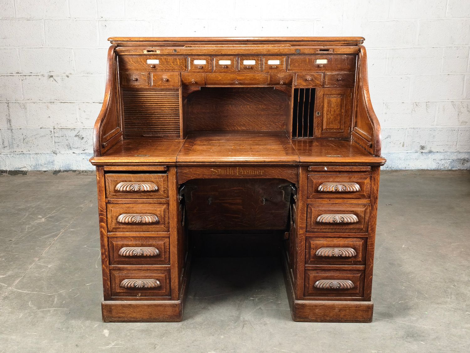 Antique roll-top desk with typewriter compartment