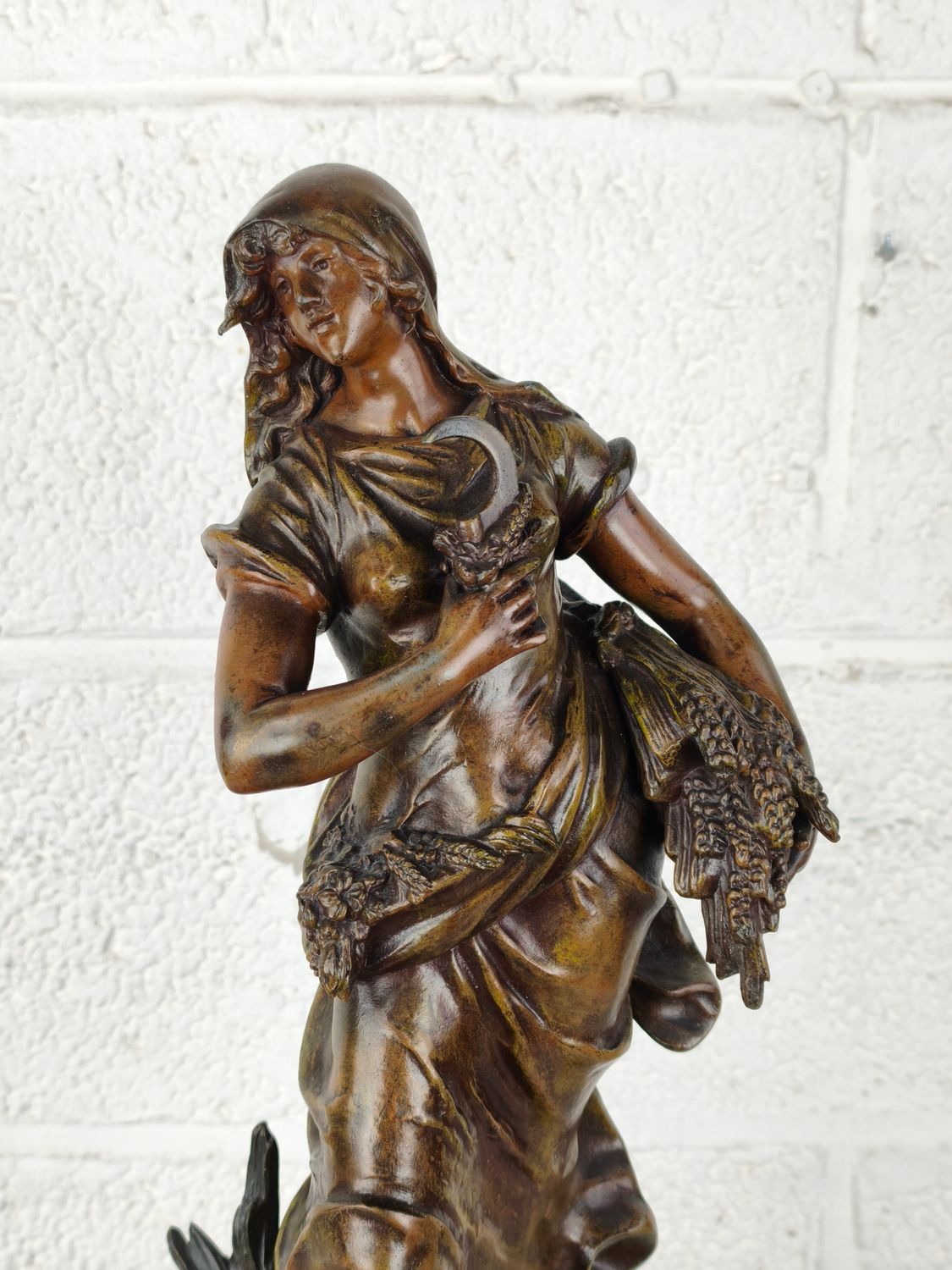 Large antique clock with zamak statue