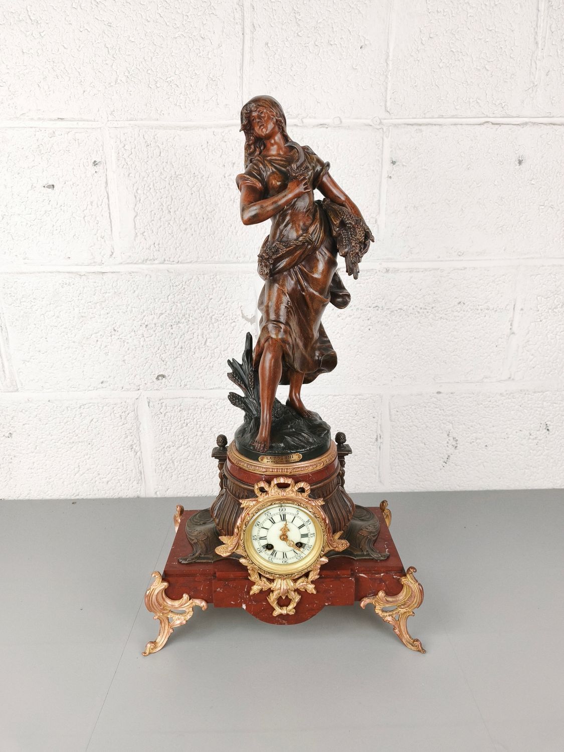 Large antique clock with zamak statue