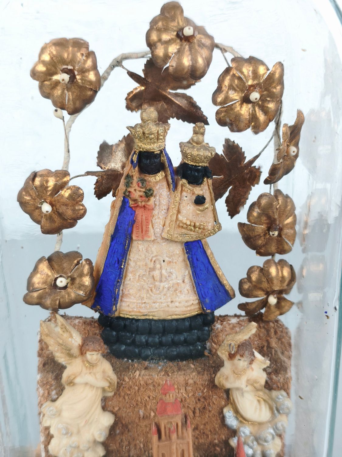 Antique glass dome with black madonna