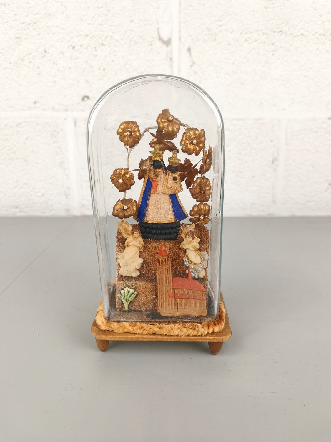 Antique glass dome with black madonna