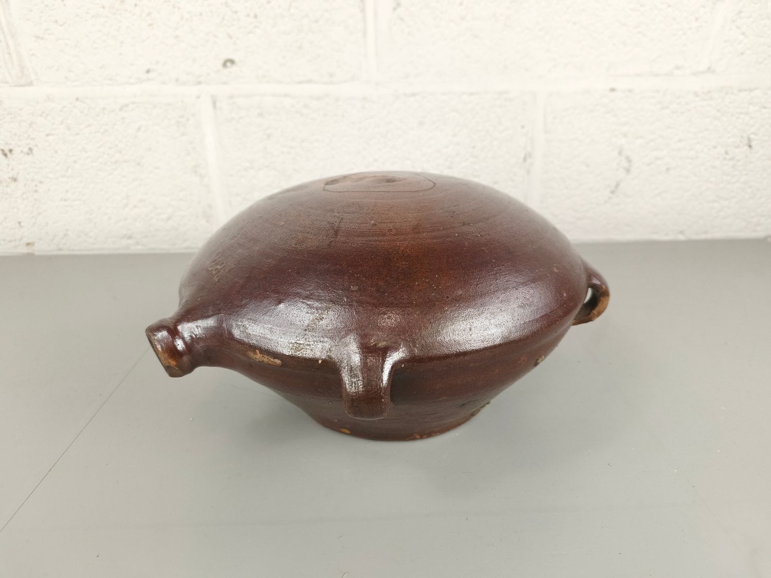 Old earthenware pilgrim jug