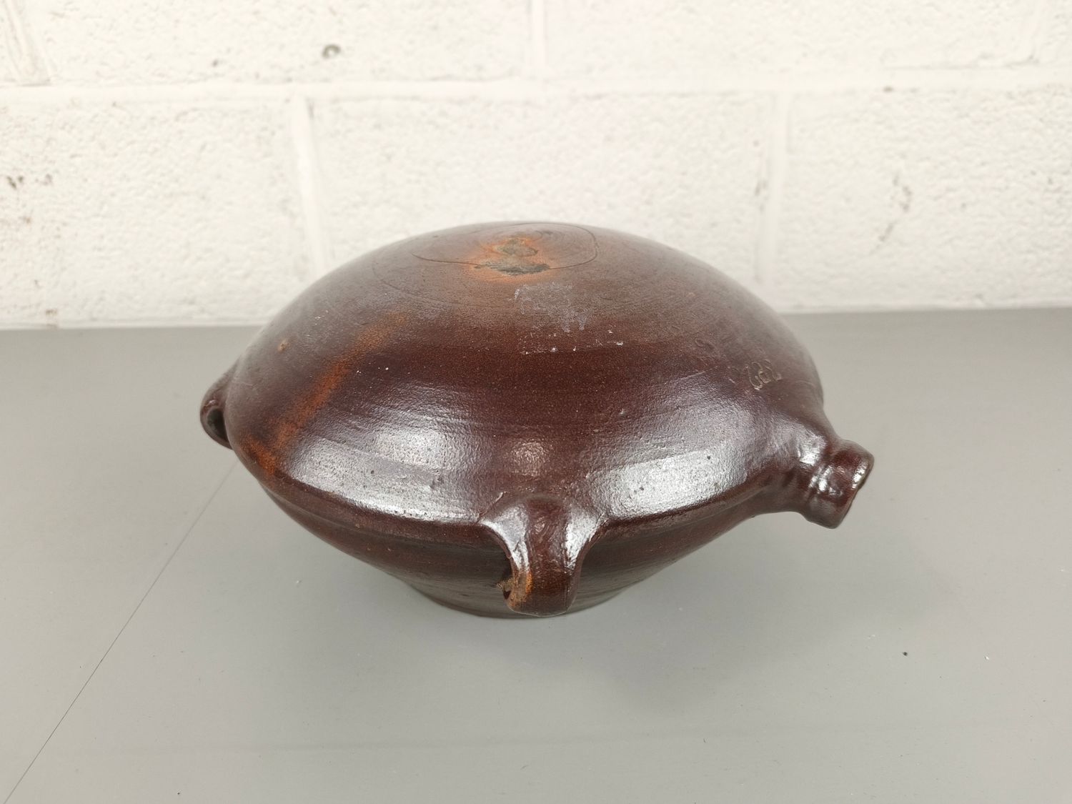 Old earthenware pilgrim jug