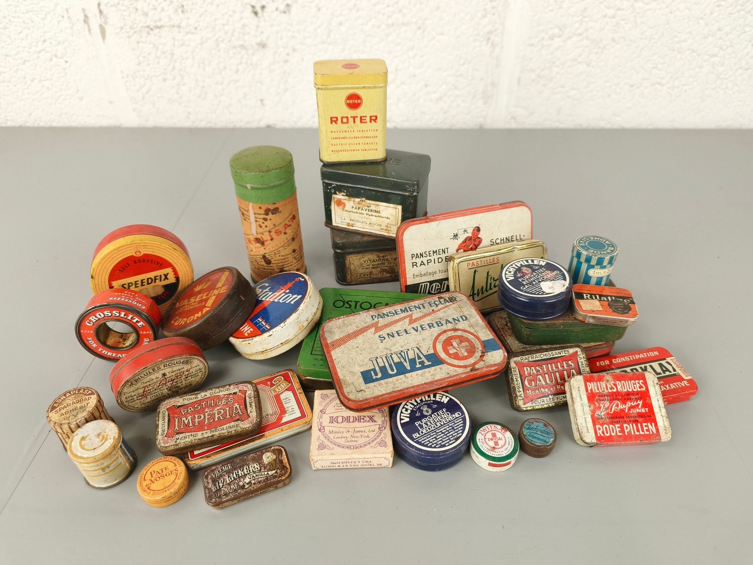 Collection of old pharmacy tins
