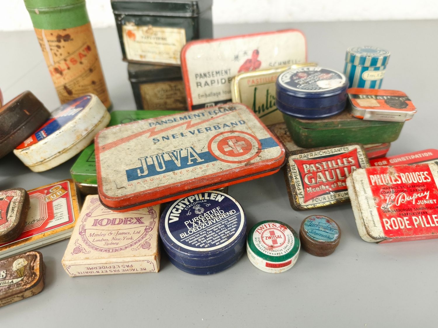 Collection of old pharmacy tins