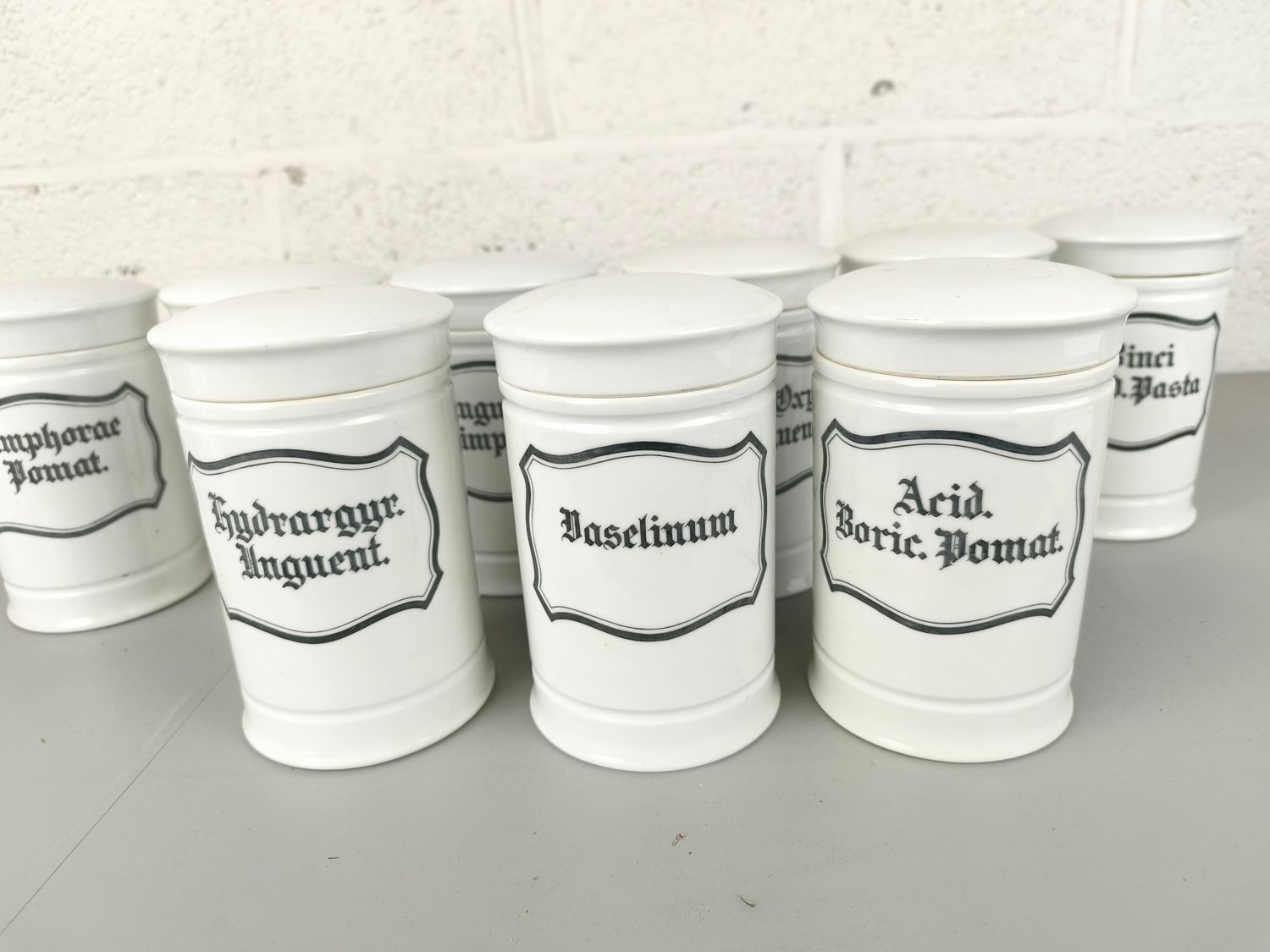 9 porcelain apothecary jars
