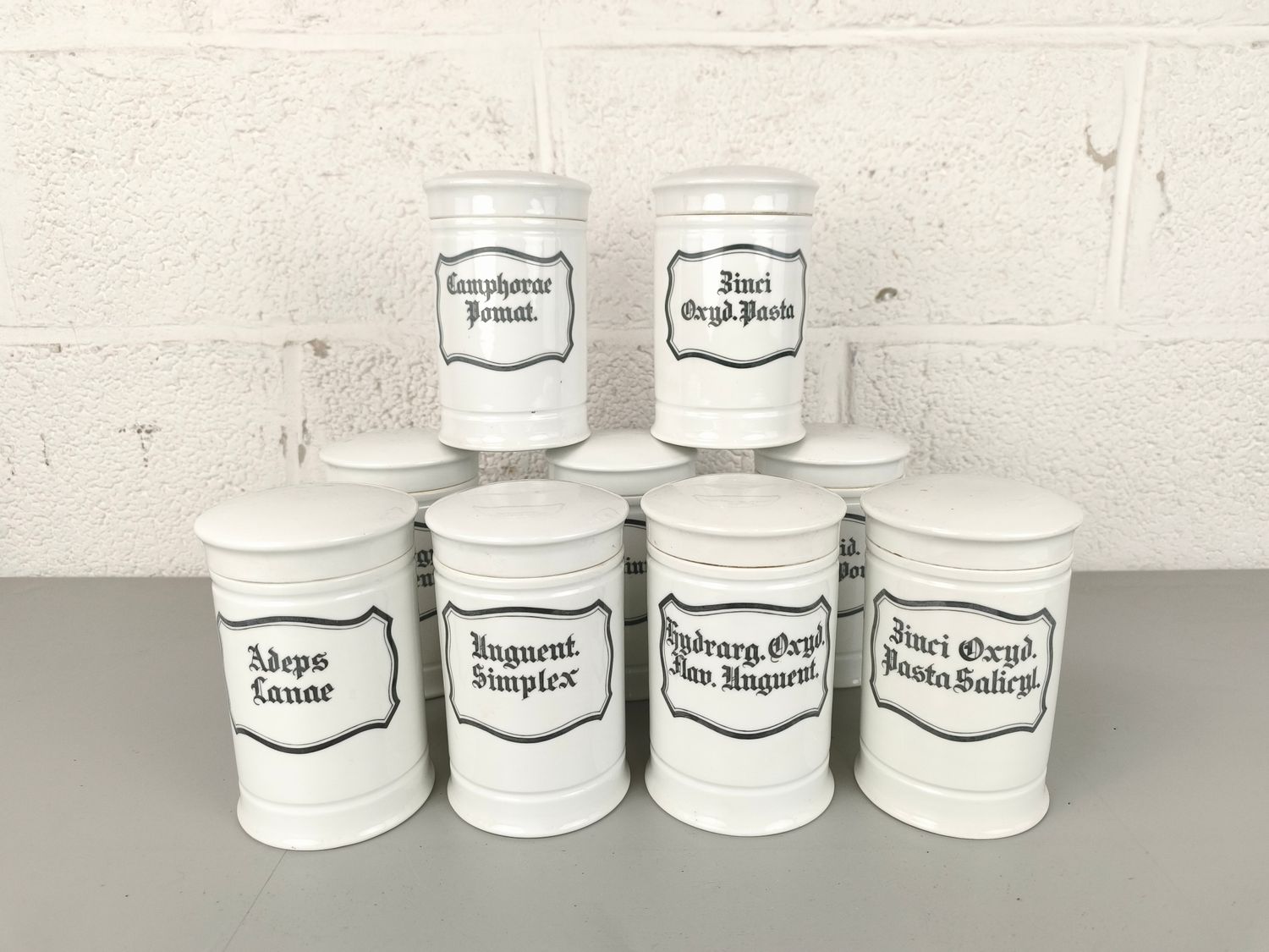 9 porcelain apothecary jars
