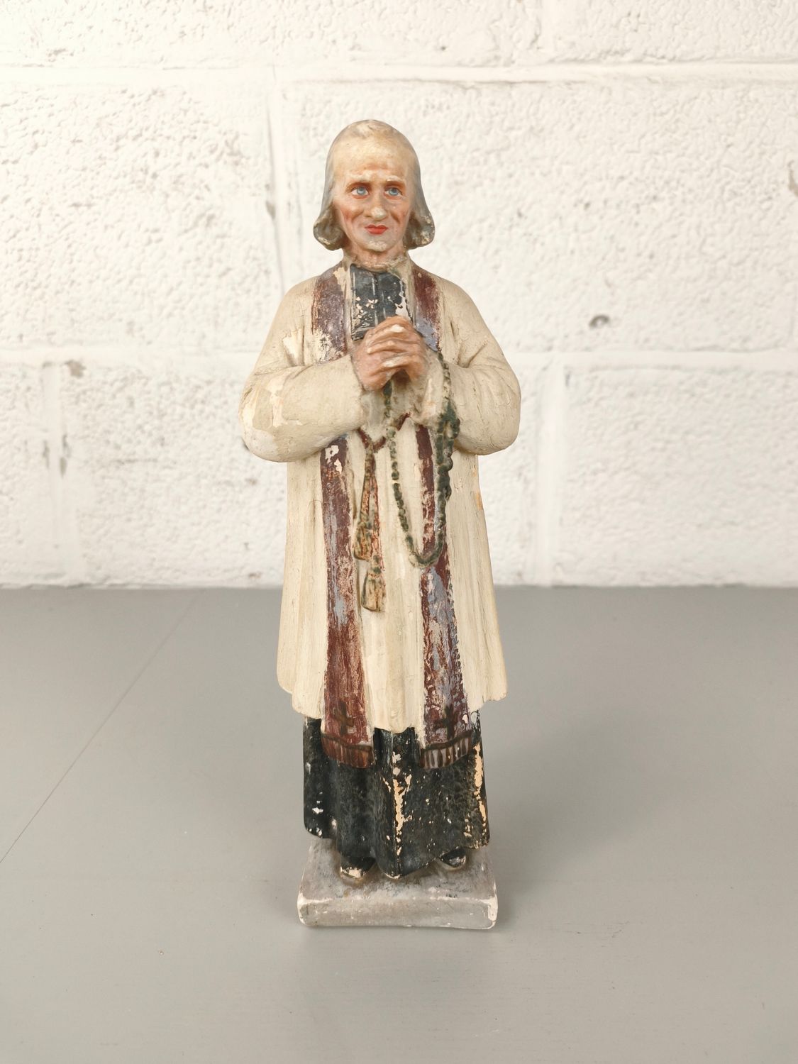 Plaster statue of Saint John Vianney