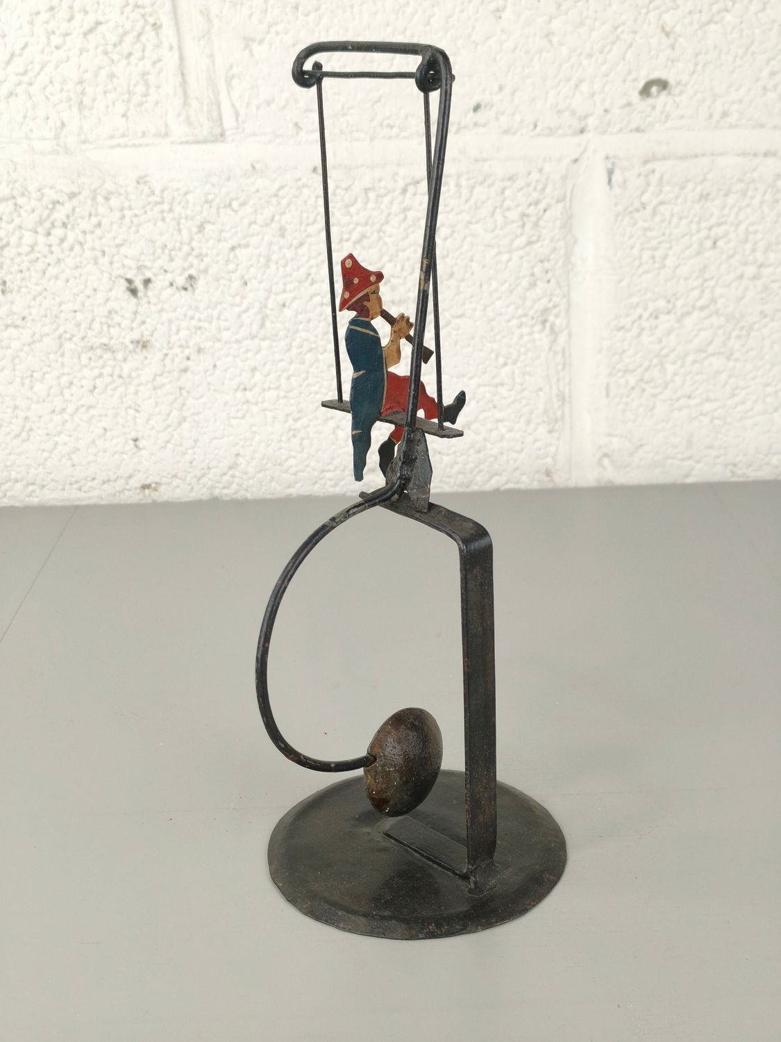 Vintage metal balancing figure