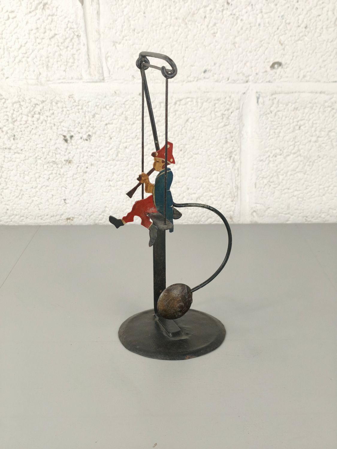 Vintage metal balancing figure