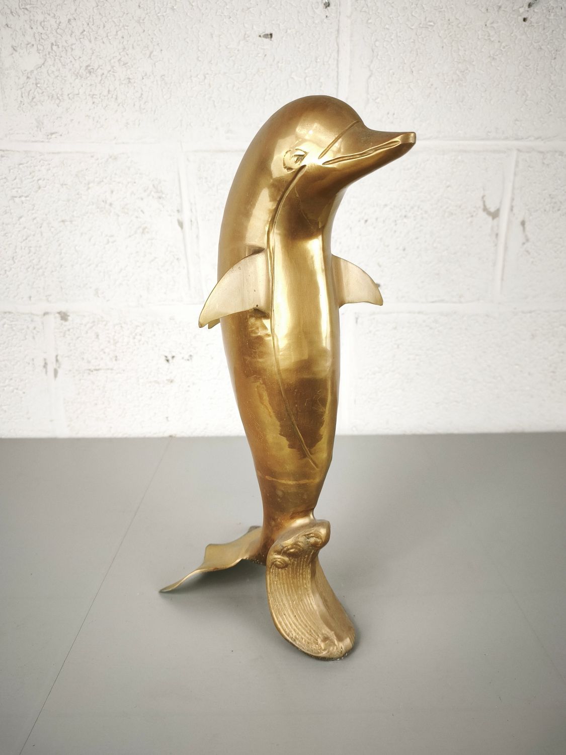 Brass figurine of a dolphin