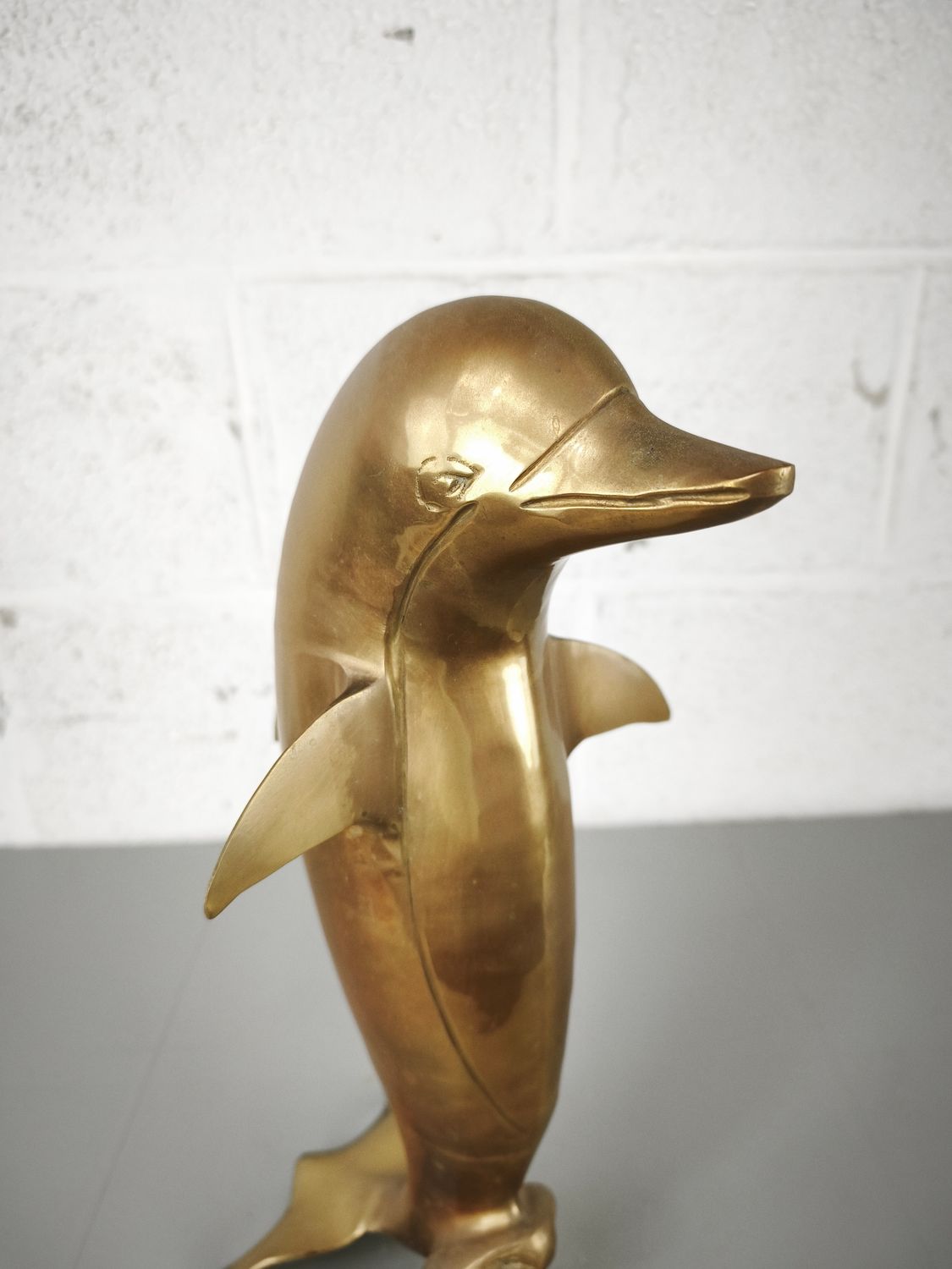 Brass figurine of a dolphin