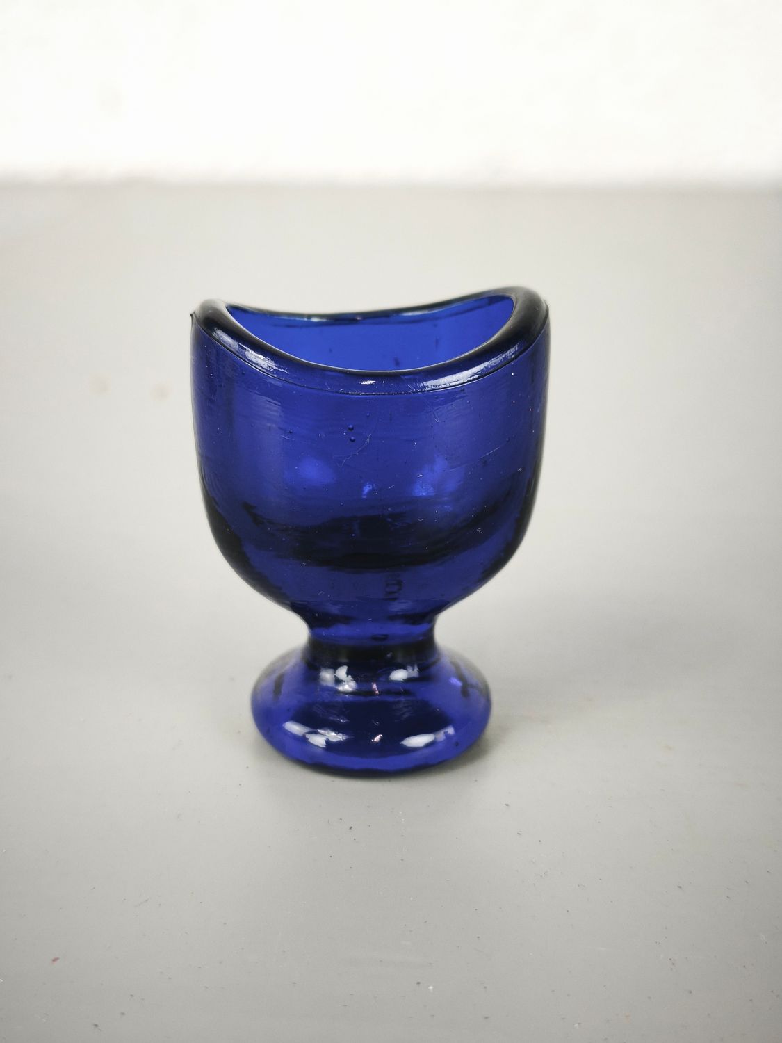 Old glass eye-bath