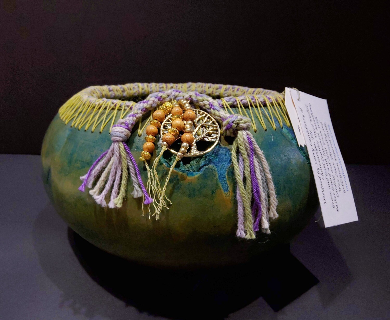Green and gold dyed and woven gourd, By Larry Castleberry