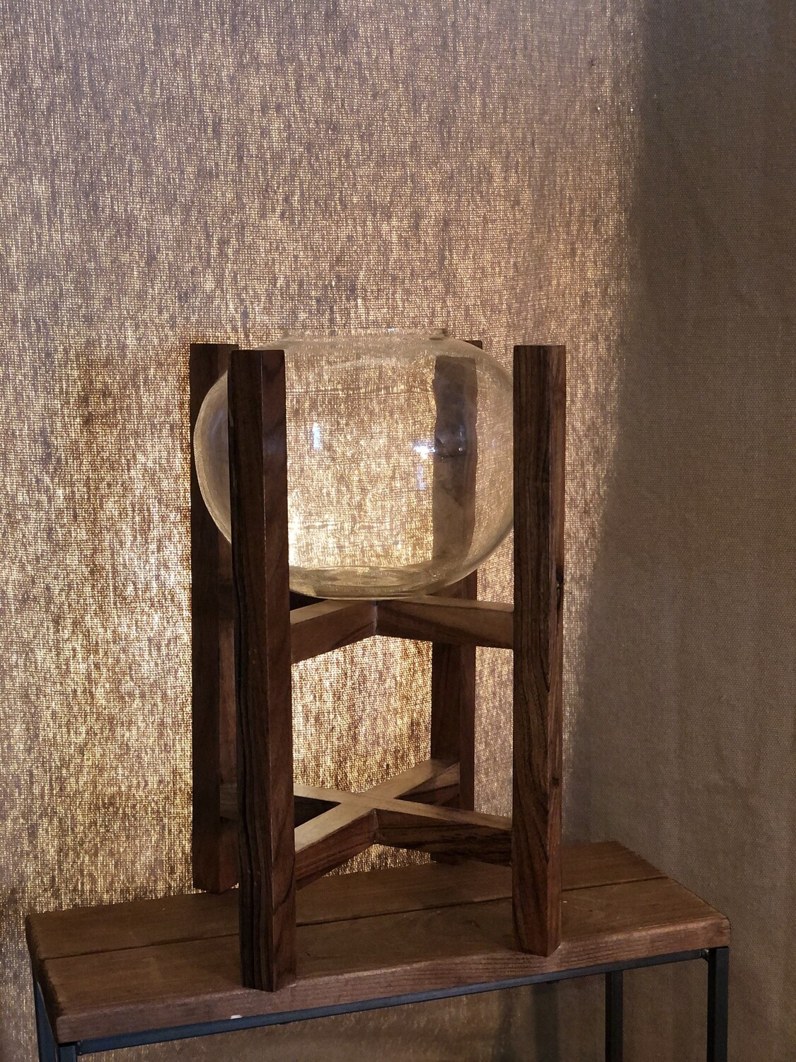 Round Glass Lantern on a Wooden Base