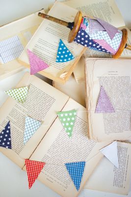 Multi-Color Paper Flag Garland on a Wood Spool