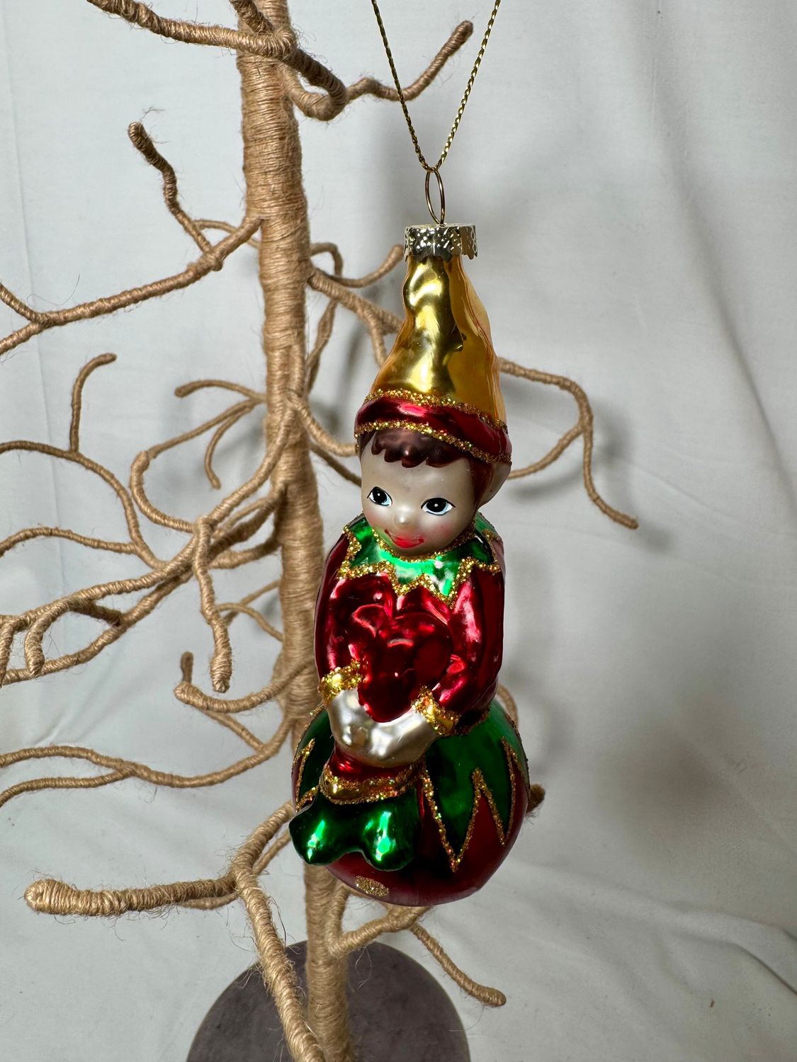 Glass Elf on Red Ball Ornament