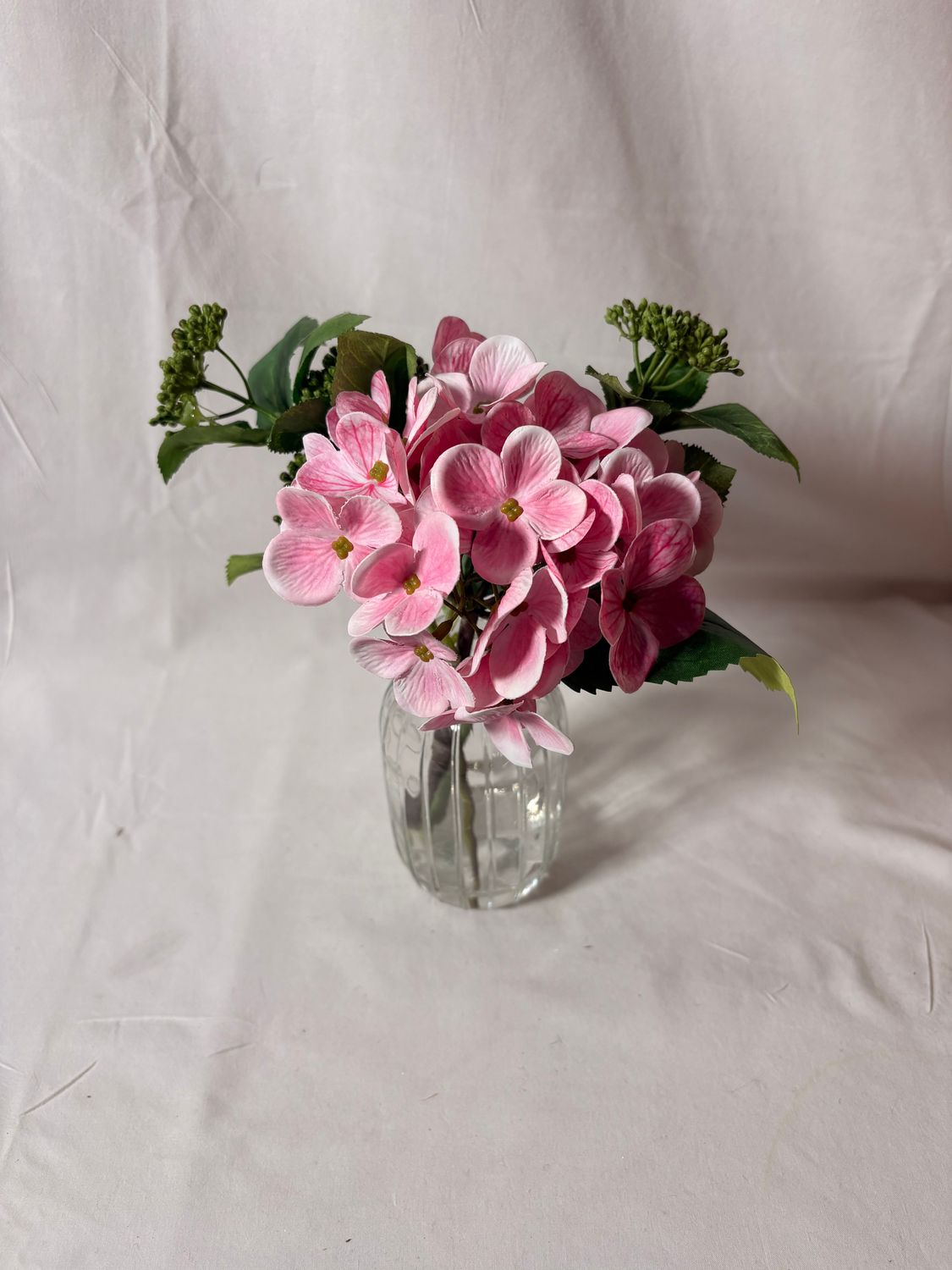 Hydrangea/Skimmia in Glass Vase 9" Pink