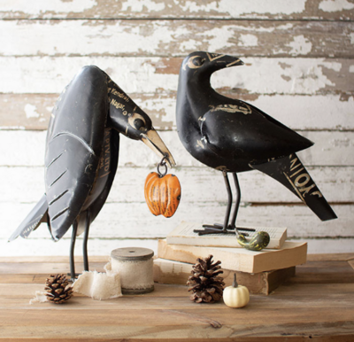 Iron Crow holding pumpkin