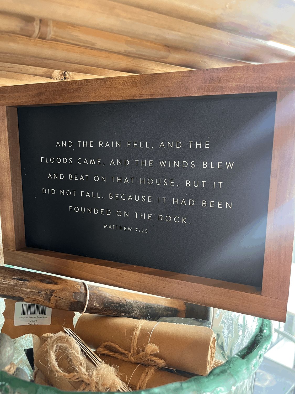 And the Rain Fell Black Sign With Dark Wood